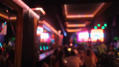 Experience a Vibrant Nightlife Atmosphere in a Contemporary Bar Setting That Attracts a Lively Crowd