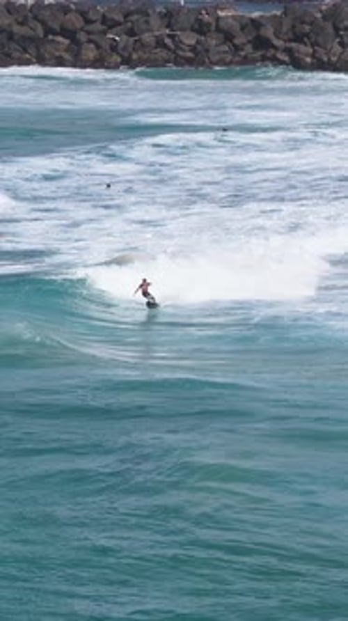 Surfers Surfing Ocean Waves In Tweed Heads, NSW, Australia - Drone, Vertical Shot
