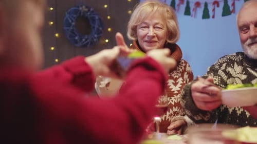 Family Sharing Meal Together at Christmas Gathering