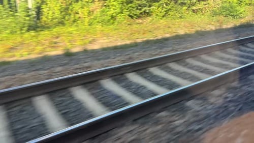Train tracks through a train window
