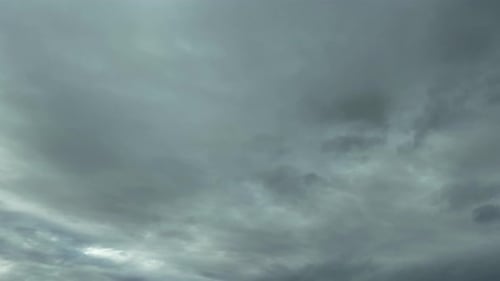 Dark Grey Clouds Drifting Across Gloomy Sky