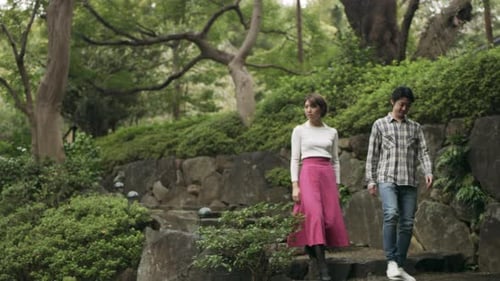 Peaceful Garden Walk with Asian Couple