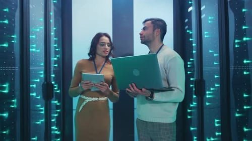 Engineers Working Inside a Modern Data Center