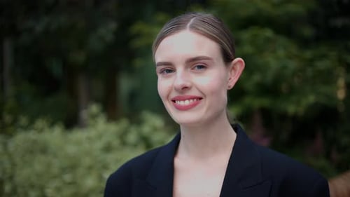 Woman Smiles in an Outdoor Environment