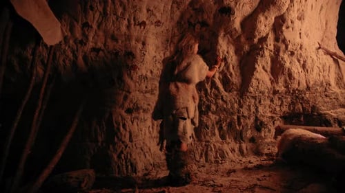 Child Painting Cave Drawings in Primitive Ancient Home