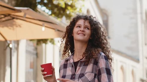Happy Woman Girl Enjoying Drinking Morning Coffee Hot Drink Relaxing Taking a Break in City Street