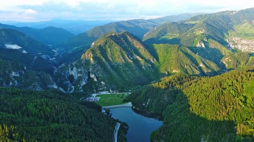 View From Rock to Town of Smolyan with Meadows for Cattle Walking and Houses Between Mountain Range
