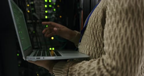 Woman Coding in Server Room