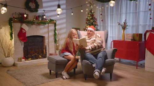 Grandfather and Granddaughter Reading Christmas Story