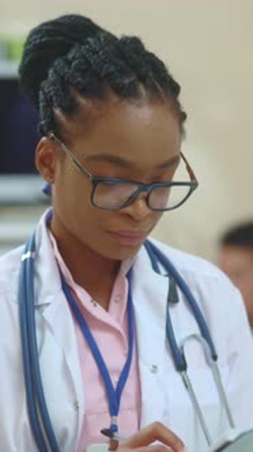 Smiling Medical Doctor Portrait in Exam Room