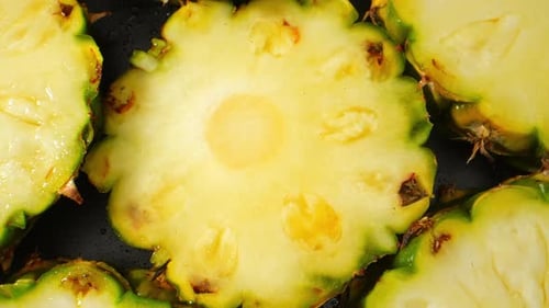 Tantalizing macro video featuring a juicy Pineapple Slice