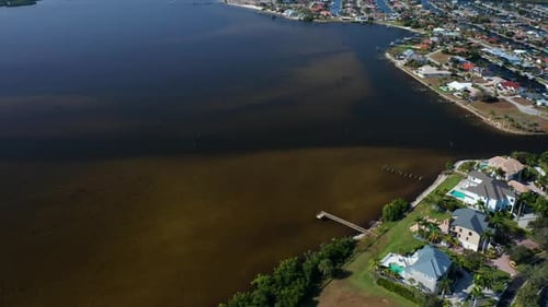 Coastal residential neighborhood with waterfront homes and docks