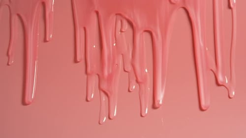 Pink paint drips from the wall.
