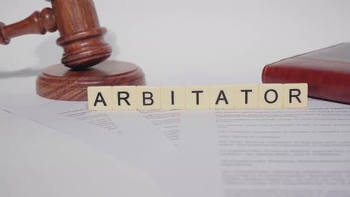 Gavel Next to Arbitrator Letter Tiles