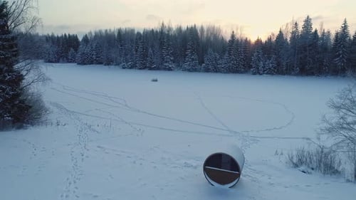 Snowy Winter Landscape at Sunrise with Sauna