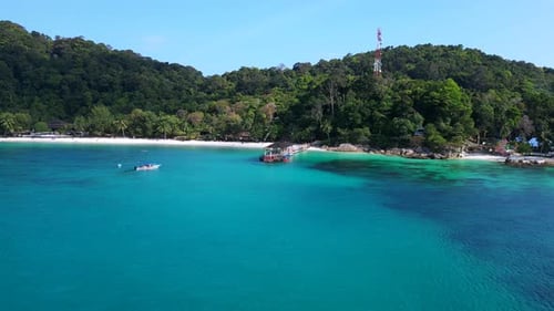 jetty pier at tropical beach, turquoise water. Fantastic aerial view flight drone