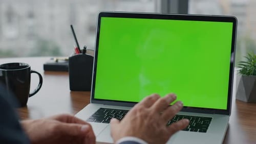 Unrecognizable Boss Looking at Green Screen Chroma Key Laptop Having Video Conference