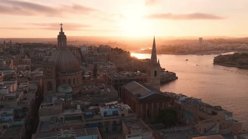 Aerial View of Valletta Malta at Golden Hour with Basilica and Spire