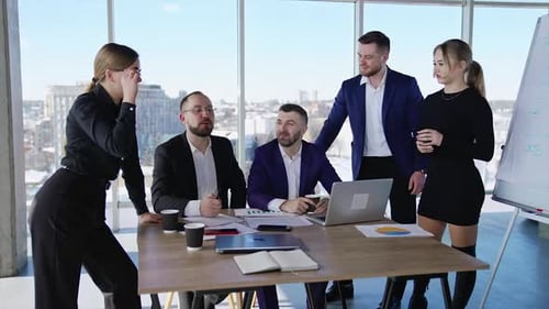 Young Adults at Business Meeting in Modern Office