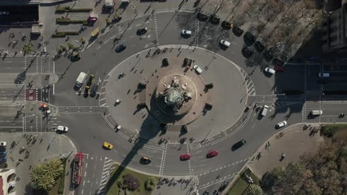Birds Eye Shot of Traffic on Multilane Roundabout Around Columbus Monument