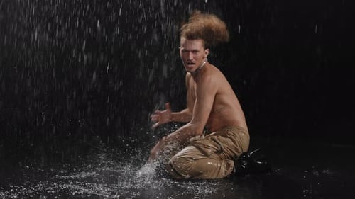 A Captivating Dynamic Dance Performance in the Rain Showcasing Expressive Movement and Artistry