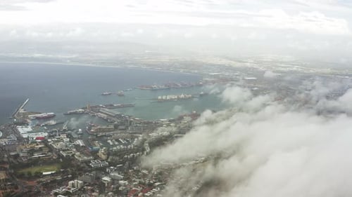 Long aerial shot of clouds hovering over Cape Town, South Africa