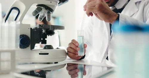 Medical Professional Testing Sample in Lab Environment