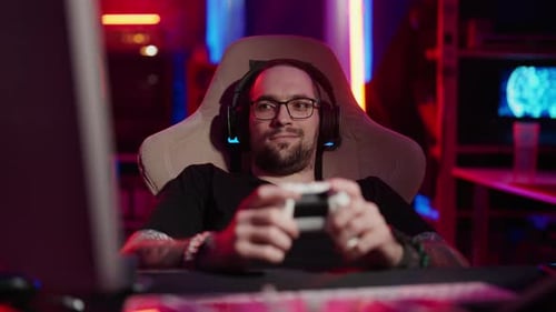 Man Playing Video Game Wearing Headphones