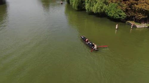 Small Boat Glides Across the Calm Lake Within the Keyan Scenic Area in Shaoxing Zhejiang China