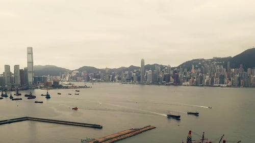 4k drone footage of a harbour alongside a city