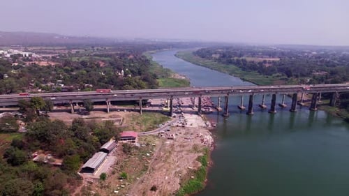 tilwara ghat with river port and Narmada River Bridge, day time, moving down, push in, drone shot, 4