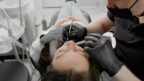 Dentistry examination of the patient's teeth dentist dental clinic patient with toothache and caries