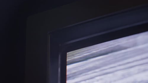 Distorted Retro Television Screen Displaying Static