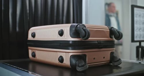 Airport Security Checkpoint Suitcases and Personal Items Moving on Xray Scanning Conveyor Belt