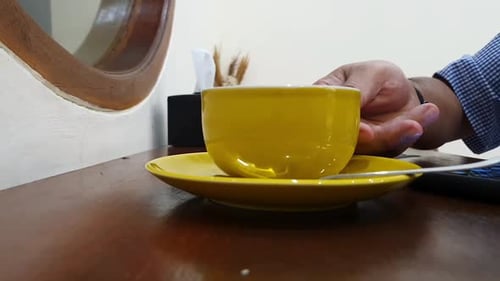 A business man drinking coffee in Cafe