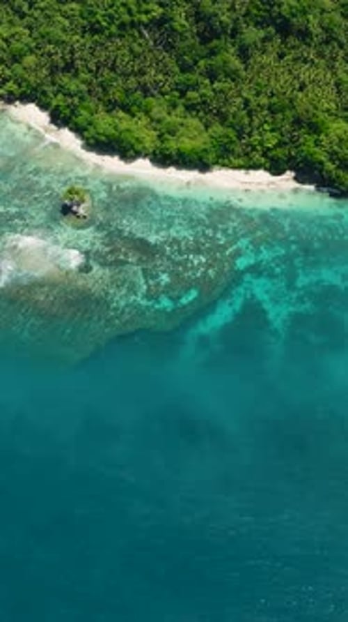 Beach and Ocean Waves on Coastline of Samal Island Davao Philippines