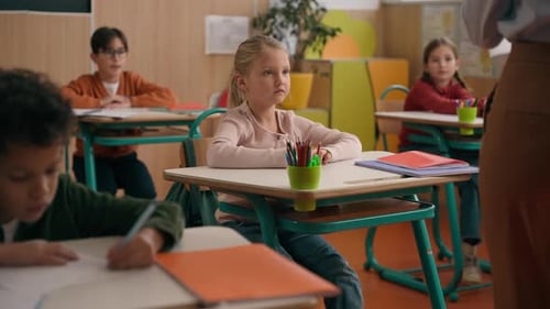 Unrecognizable Female Tutor Teacher Give Test Papers to Children Exam School Elementary Education