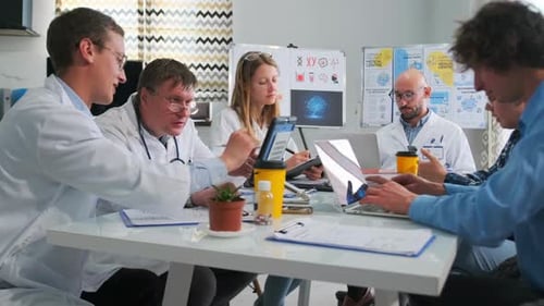 Doctors and Researchers Discussing Medical Innovation at Hospital Meeting