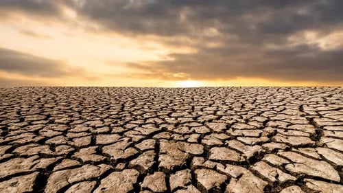 Cracked Earth Landscape at Dramatic Sunrise