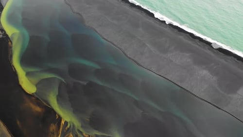 Aerial view of a river along the coast in Iceland.