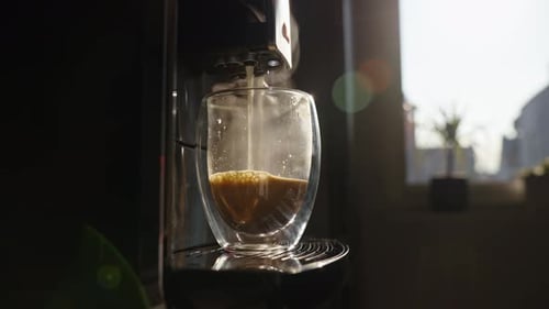 Espresso Machine Pours Steaming Coffee in Glass Cup