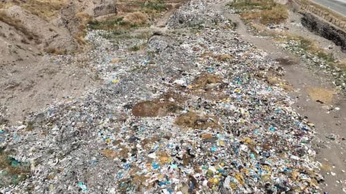 City garbage dumped by the roadside