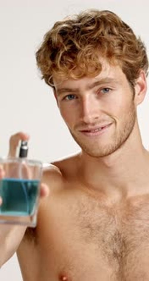 Attractive Man Sprays Cologne