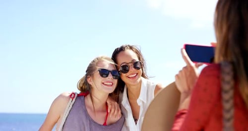 Friends Smile and Laugh on Sunny Beach Day