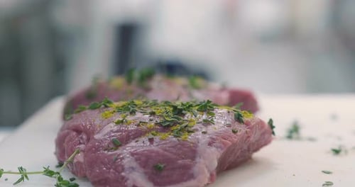 Preparing Raw Meat with Herbs and Spices