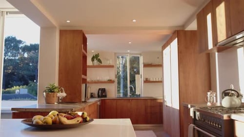 Modern Kitchen Interior with Wood Cabinets and Sunlight