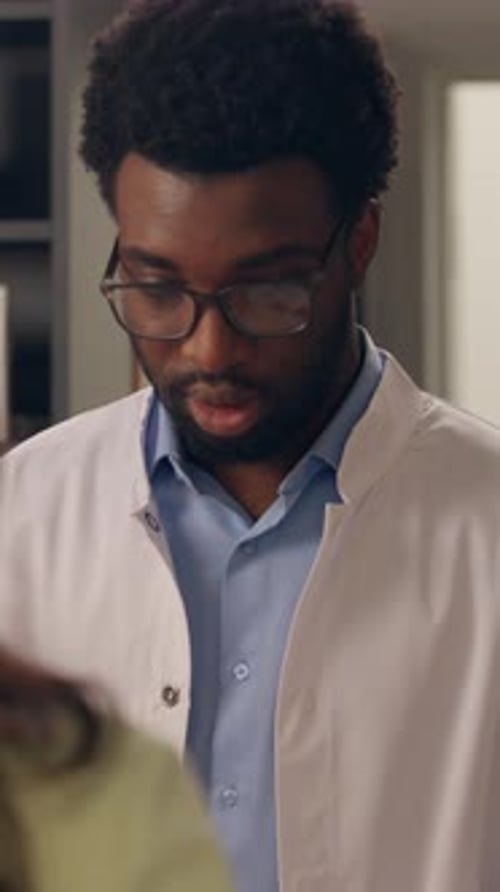 Pharmacy Cashier Counter African American Man Pharmacist Reading Medical Prescription Receipt Buying