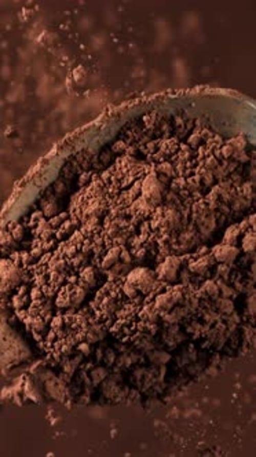 Cocoa Powder Falls From a Spoon Filmed on a Highspeed Camera at 1000 Fps