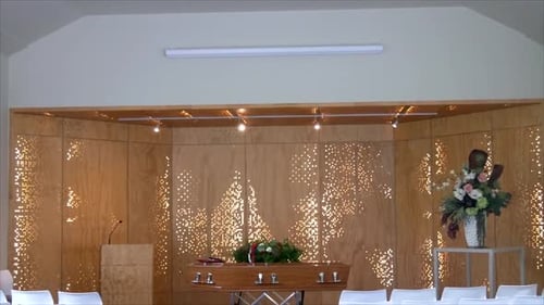 closeup shot of a funeral casket in a hearse or chapel or burial at cemetery