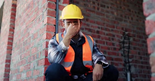 Glasses, tired or man with stress at construction site, building deadline